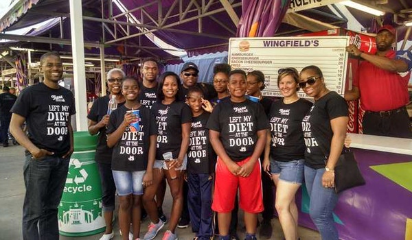A group at a cookoff wear their custom t-shirts that read "Left My Diet at The Door." 