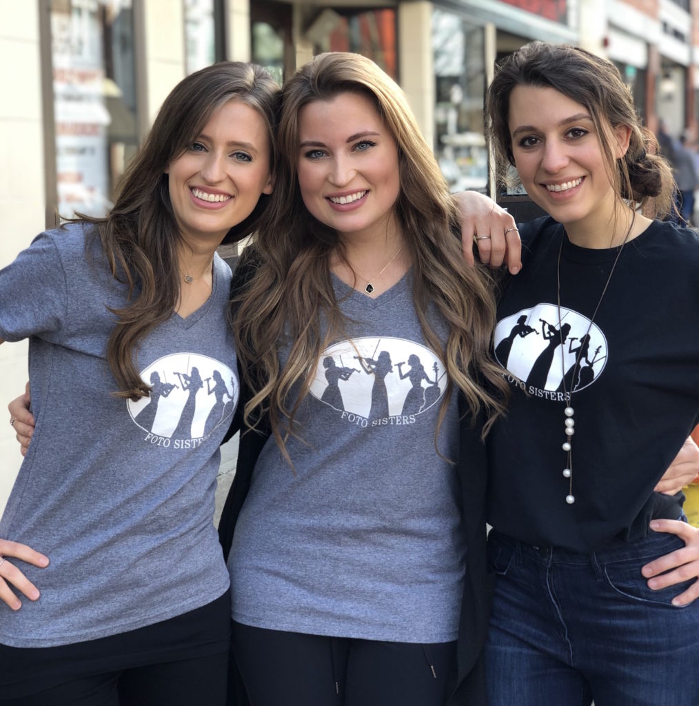 Three young women in matching custom t-shirts