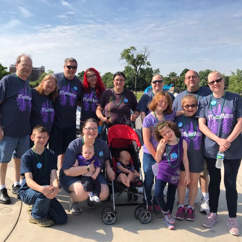 Group of supporters wearing custom shirts gather for a photo at a Cystic Fibrosis fundraiser walk