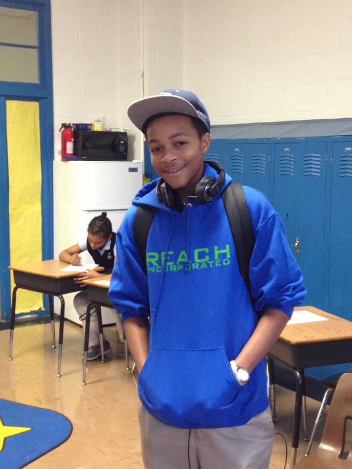 Young tutor wearing custom hoodie after promotion