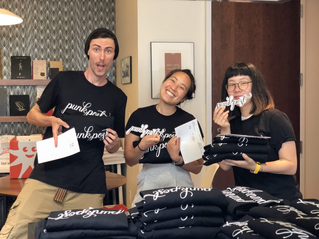 Photo of Punkpost employees wearing custom shirts