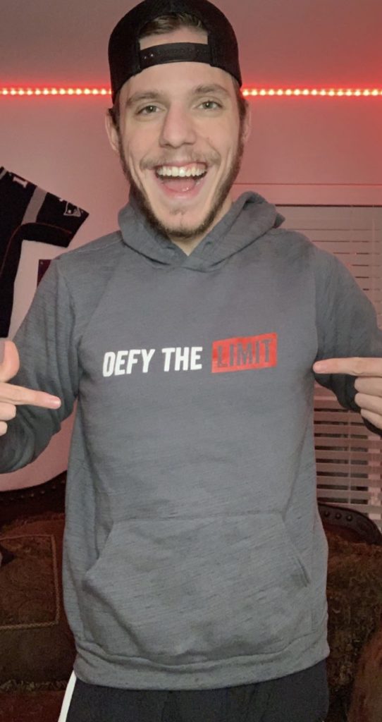 Jacob showing off his Defy the Limit hoodie