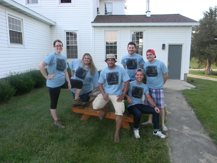 A paranormal club wearing matching custom t-shirts