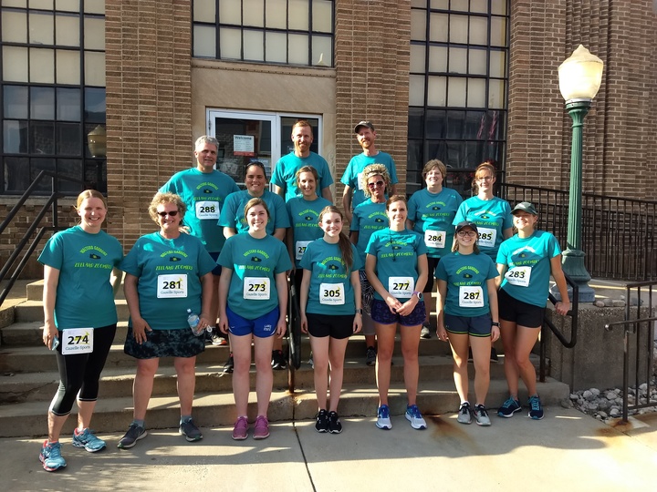 Group of runners wearing matching team shirts