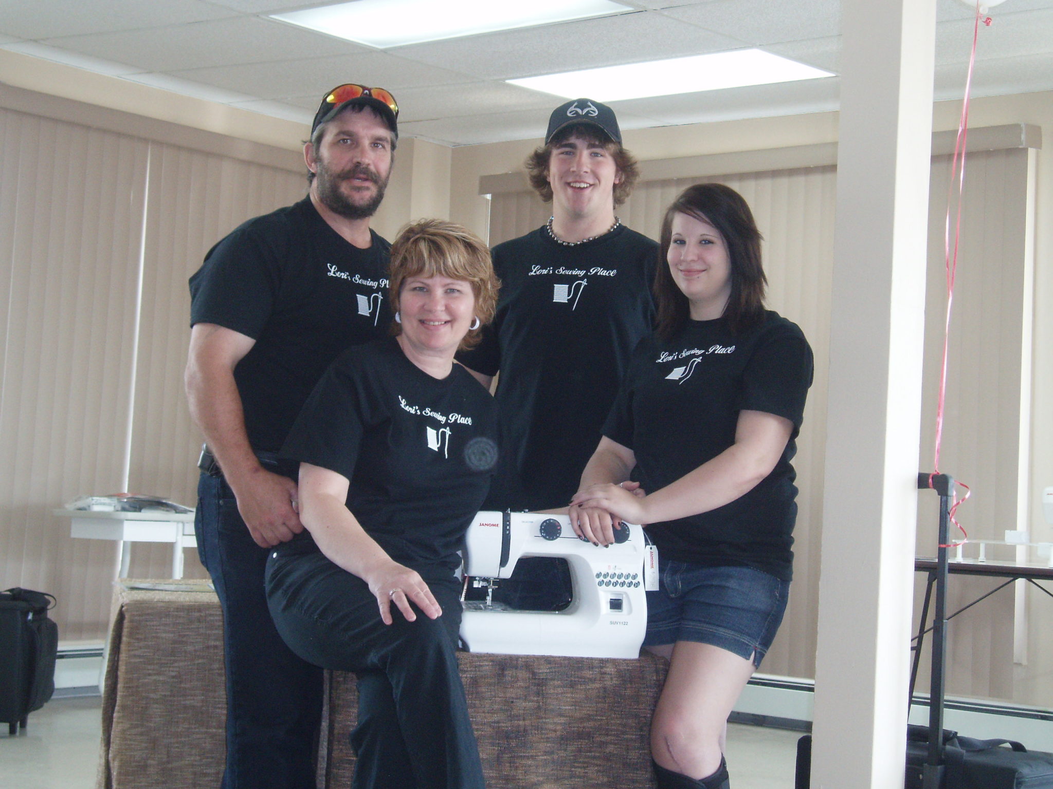 A sewing club wearing matching custom t-shirts.