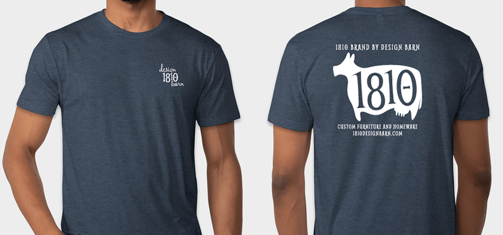 Model with front and back of an dark blue t-shirt with the 1810 Design Barn logos on the front and back