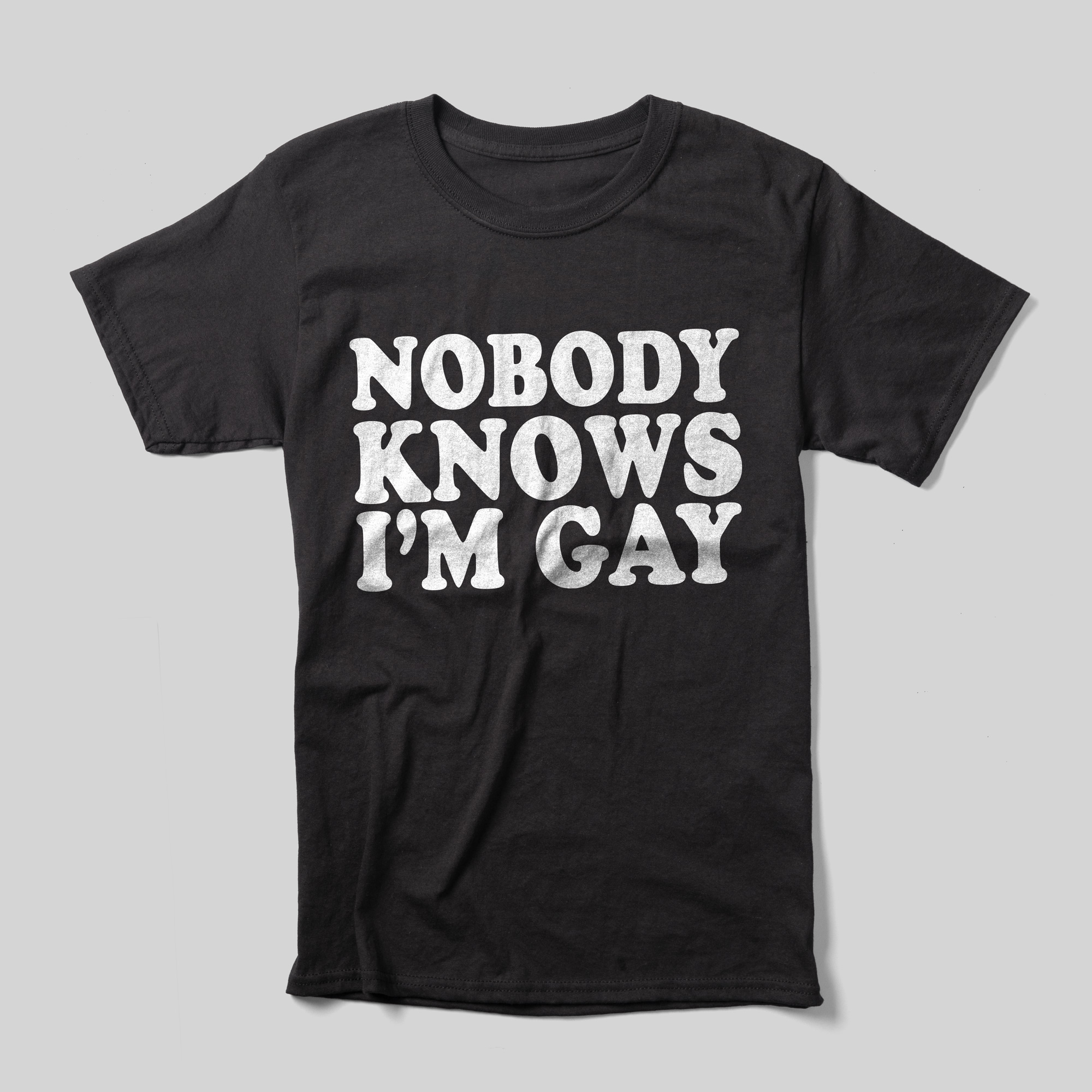 A black t-shirt that reads "Nobody Knows I'm Gay" in white text.