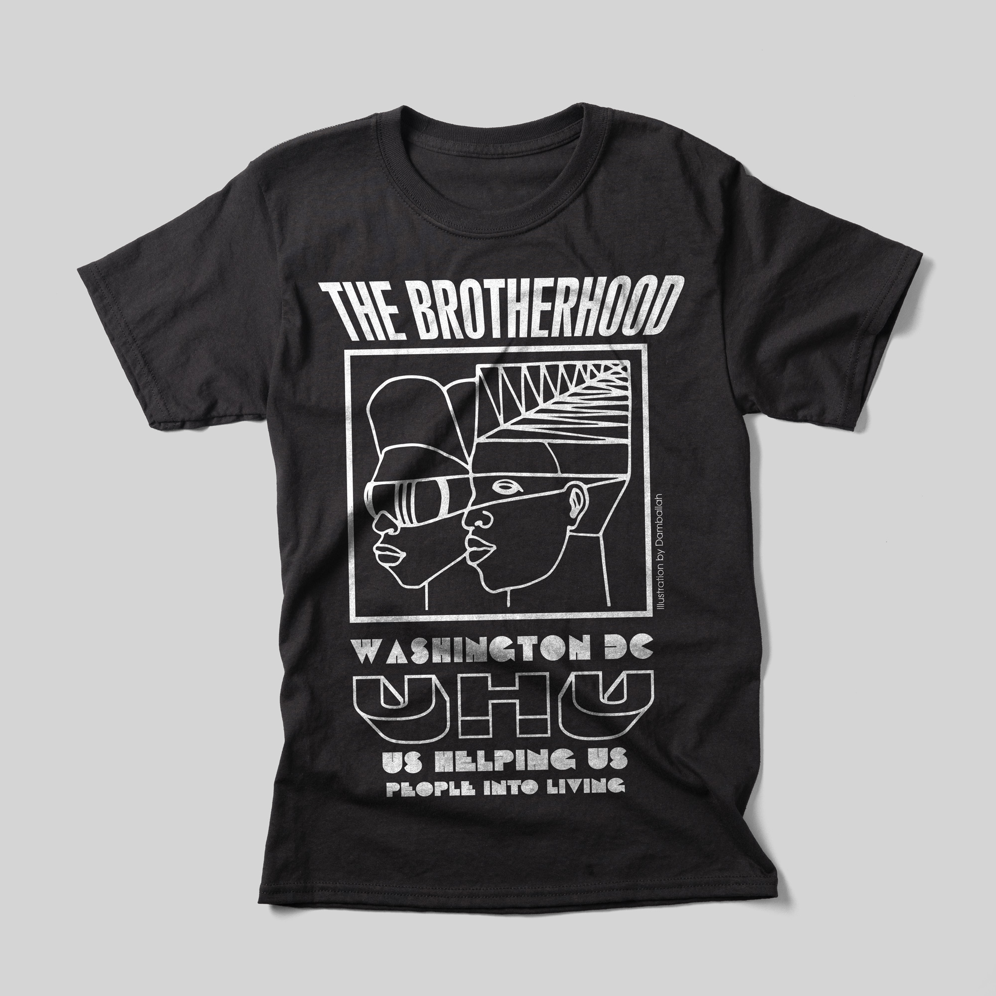 A black t-shirt that says "The Brotherhood Washington DC UHU Us Helping Us People Into Living" in white text. Beneath The Brotherhood is a single-line illustration of two African American people.