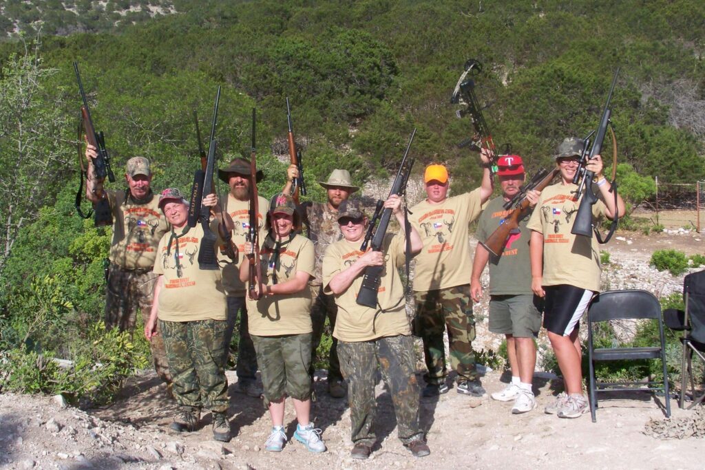 A group of friends and family wearing matching custom t-shirts on a hunting trip. 